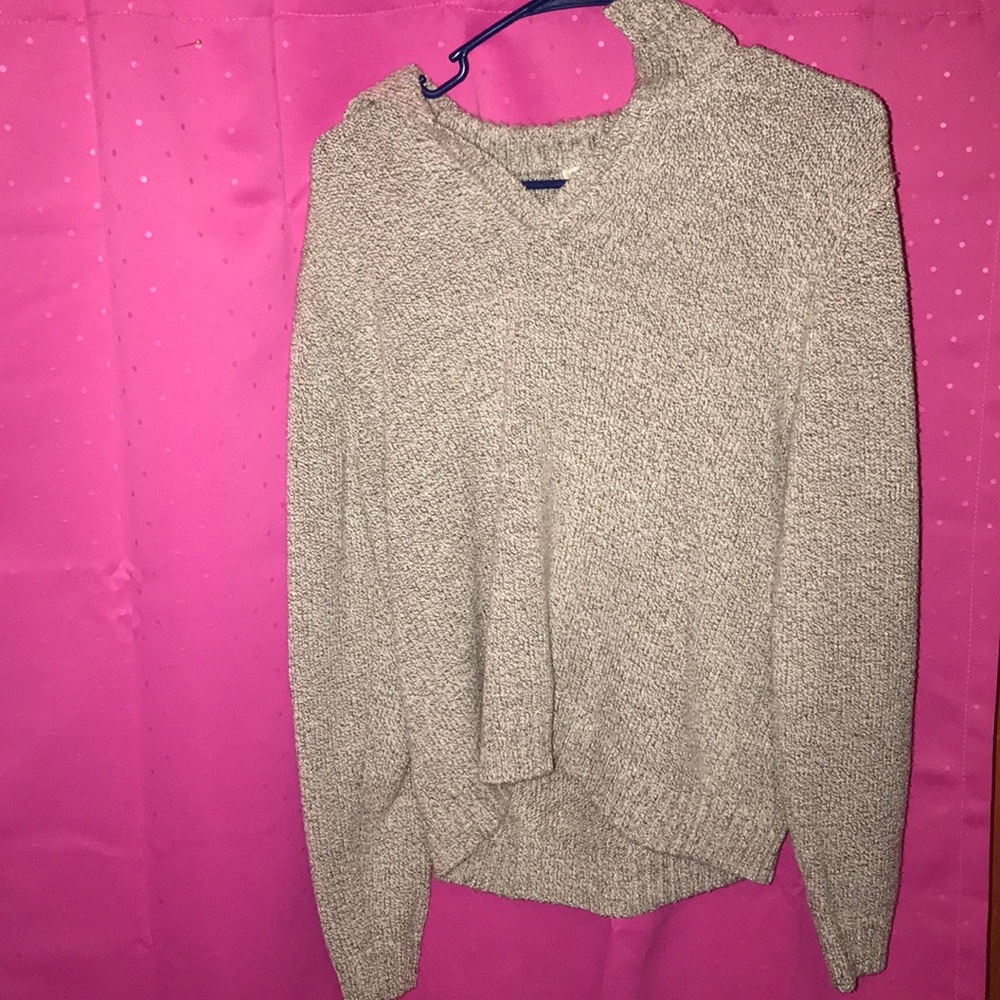 A cream and black sweater